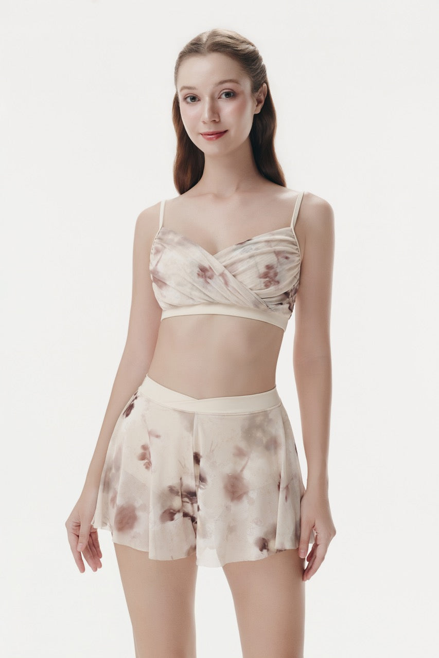 Woman wearing a floral two-piece outfit on a white background Serene Beige designed by Spincess